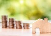 Debt Respite Scheme image of wooden house and coins