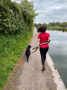 Lisa Rivers running with her dog