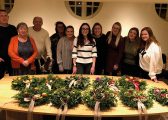 Community Round up 2022 picture of some of the Hibberts Team with Christmas wreaths