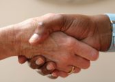 Image of two people shaking hands to represent the need for an Employment Contract, not just a handshake