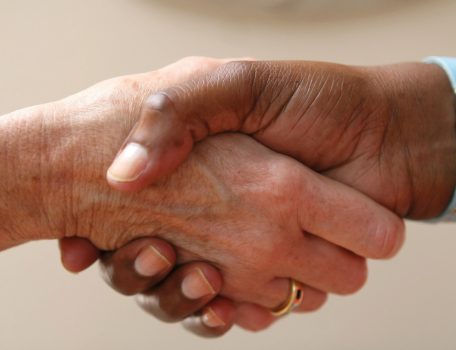 Image of two people shaking hands to represent the need for an Employment Contract, not just a handshake