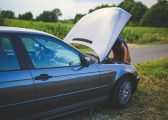 Image of a broken down car at the side of the road with the bonnet up and the driver looking under the bonnet for the Faulty Car After Purchase? Know Your Consumer Rights UK blog